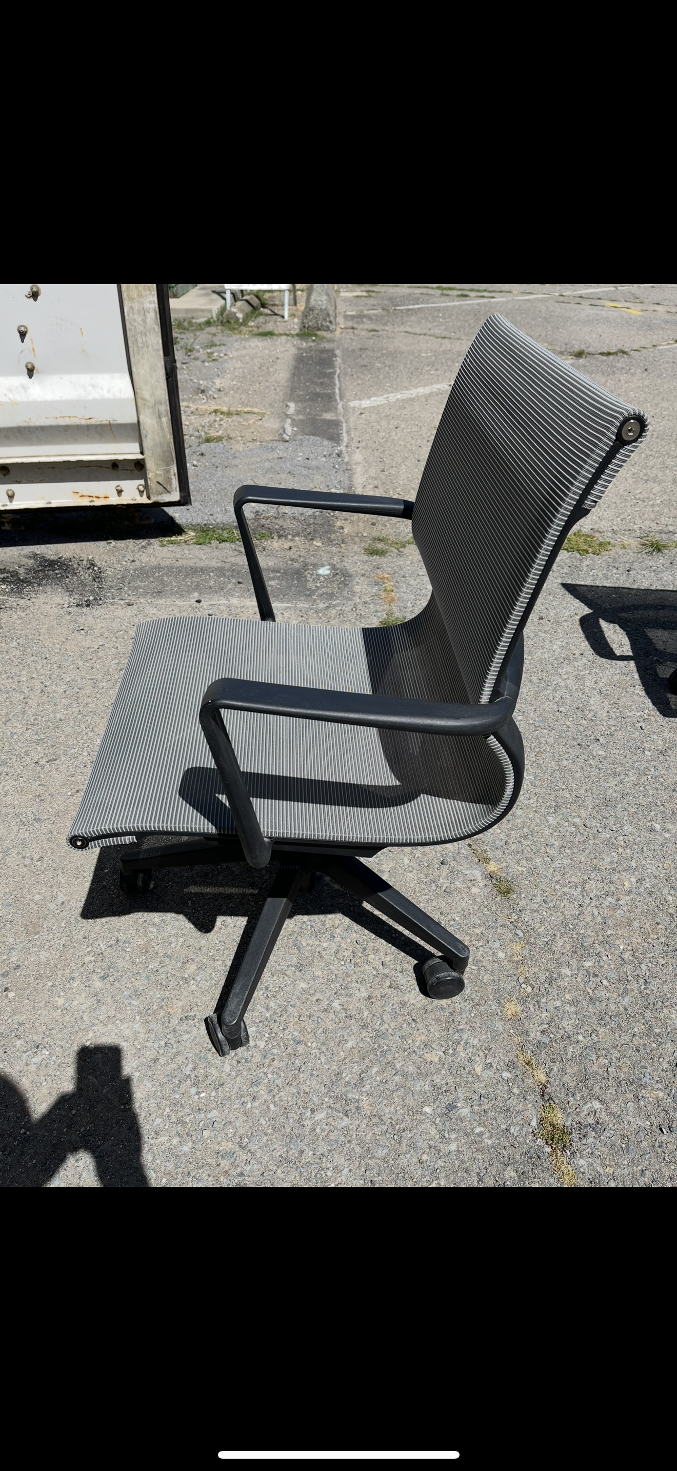 Gray mesh rolling conference chairs
