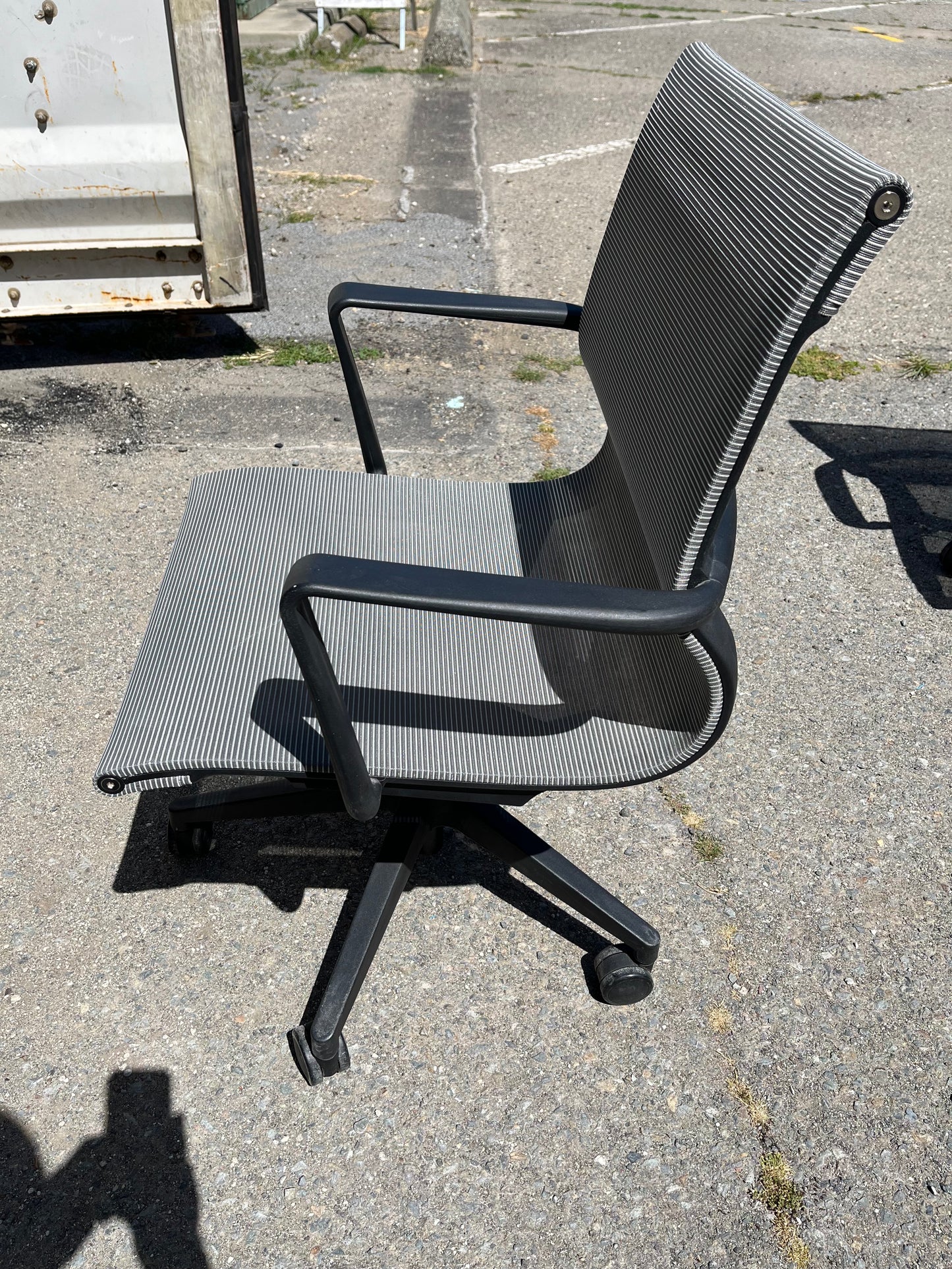 Rolling gray mesh conference room chairs