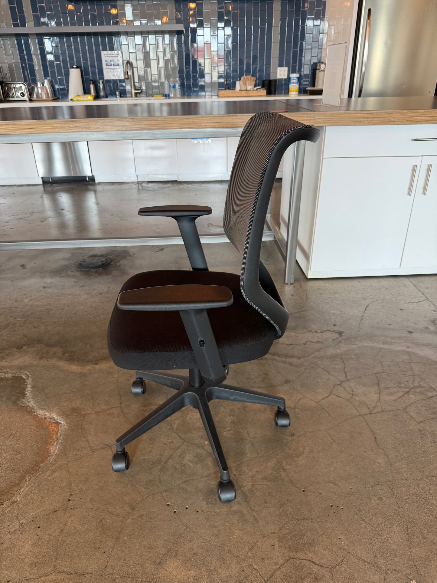 Black mesh chair adjustable arms and recline