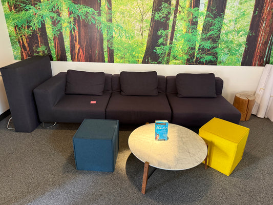 Gray three seater couch with ottoman