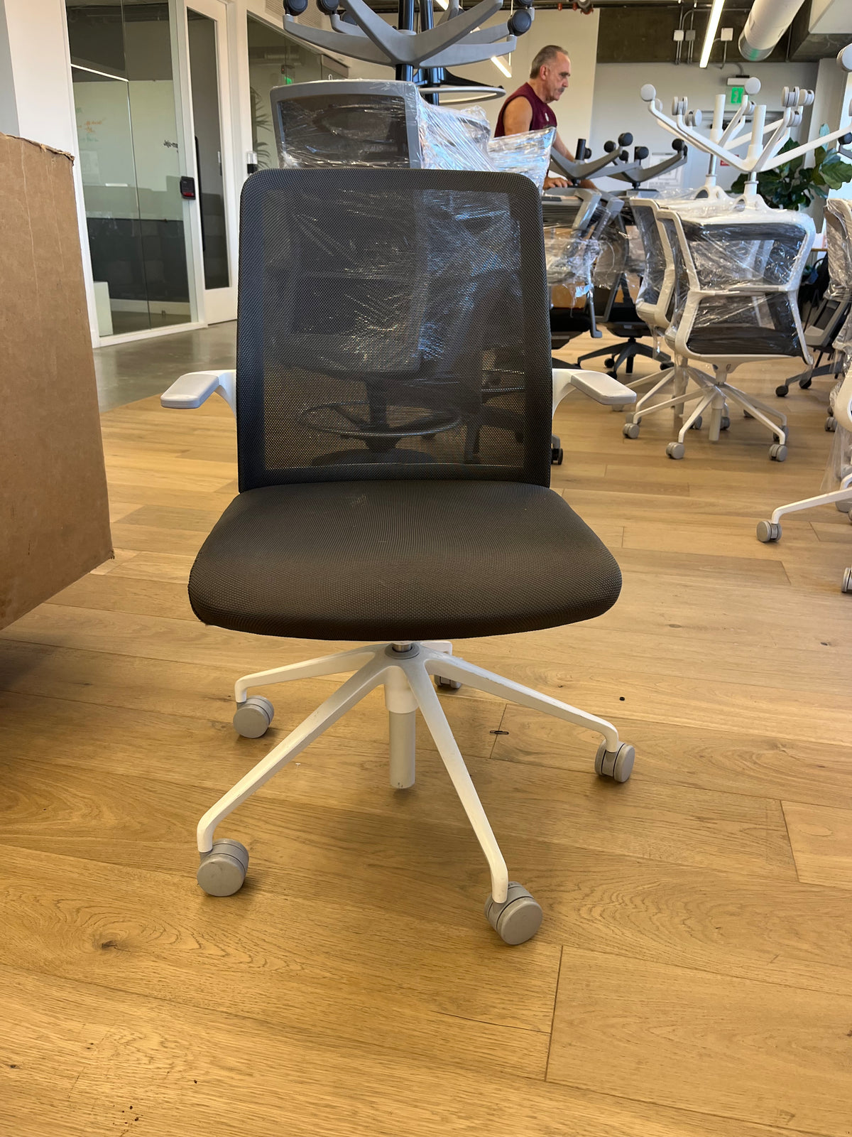 White mesh conference chairs with fixed arms