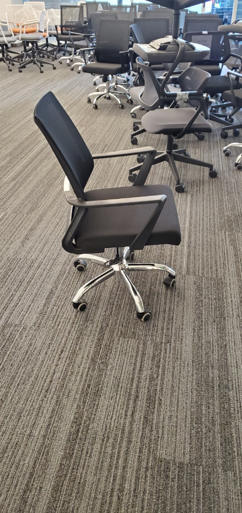 Black and chrome rolling office chairs